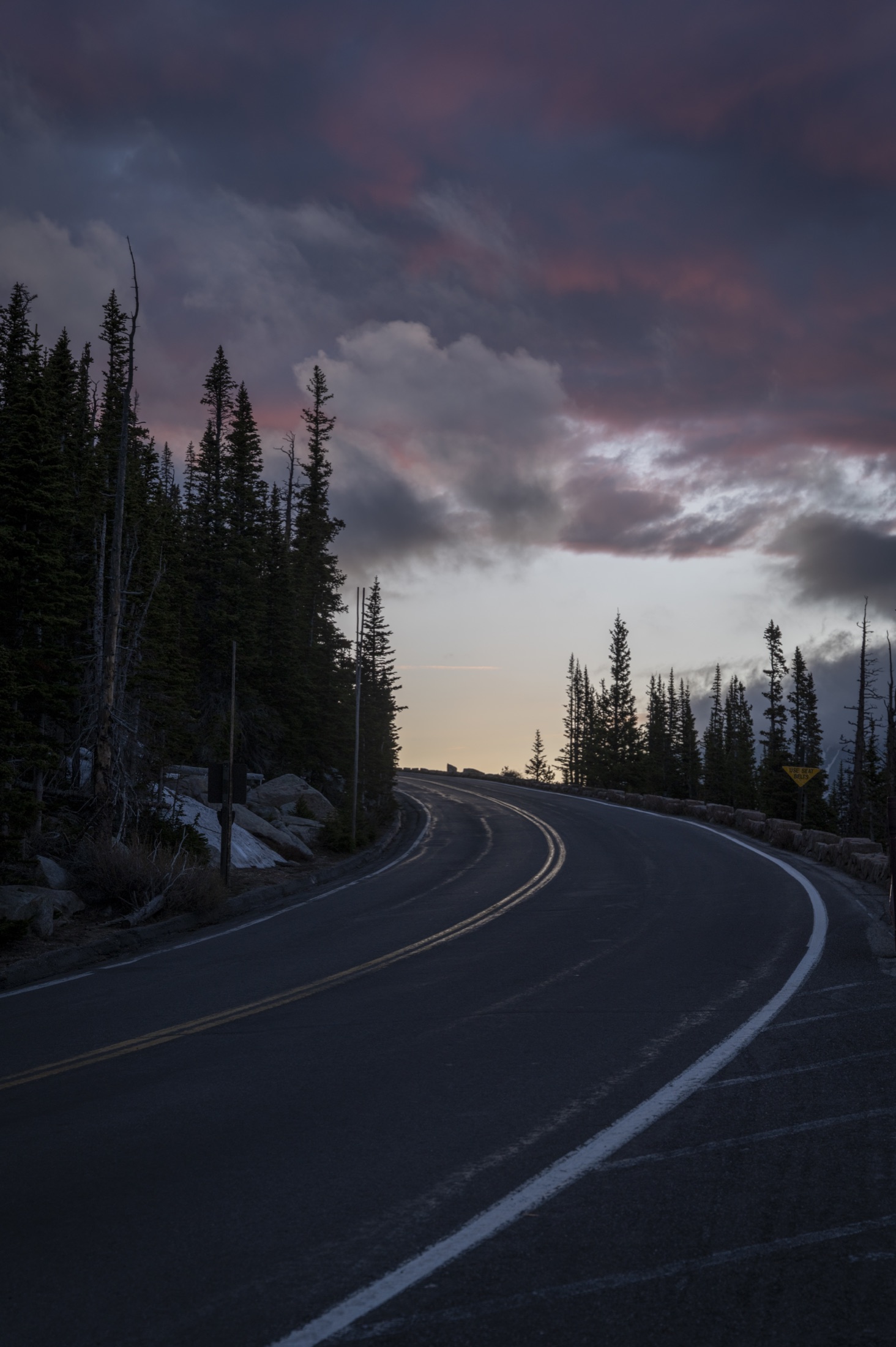 Curving alpine road at twilight